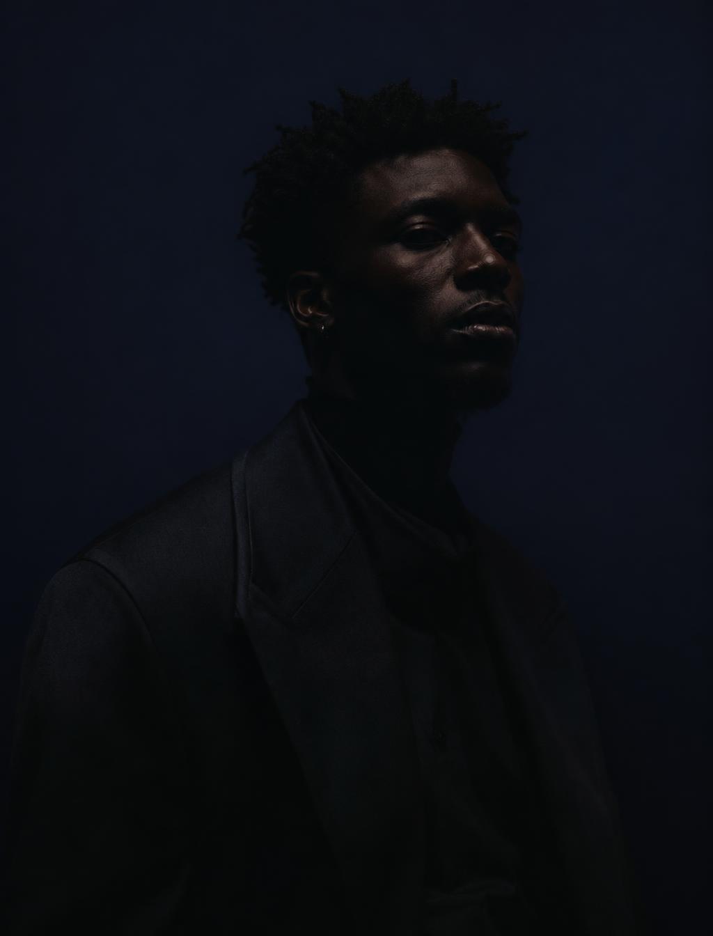 Placeholder: editorial portrait of a male artist